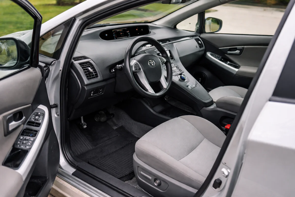 Interior view showing dashboard and driver area.